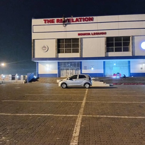 The Big Landmark exterior signage at night