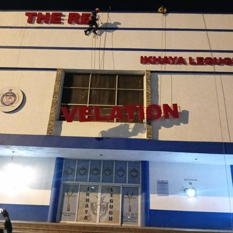 Illuminated storefront lettering at The Big Landmark