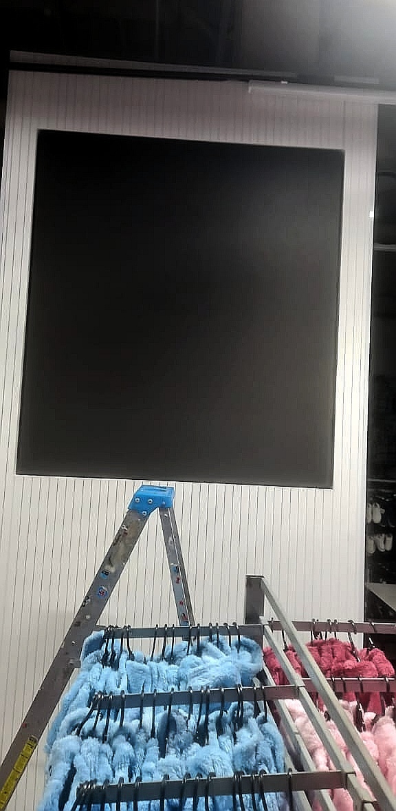 Freestanding portrait digital display during installation